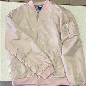 A Salmon/ Pearl colored Bomber Jacket